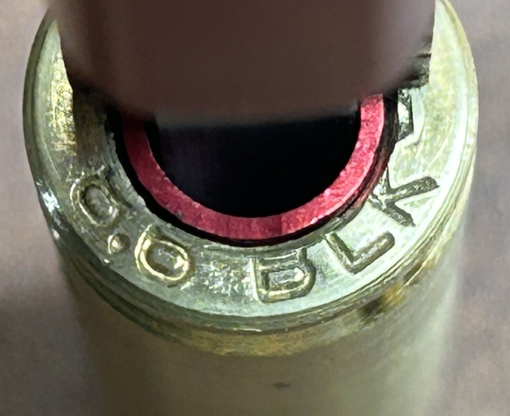 lose-up headstamp view of a custom-tapered LAPre 8.6 BLK modified rifle brass case with internal tracking threads.